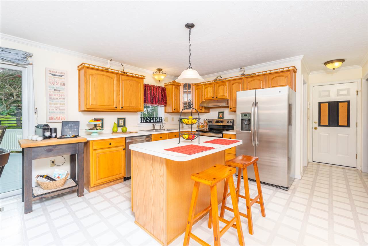 66 Cedar Ridge Road Waynesboro, VA 22980 - Photo 15 of 48 a kitchen with stainless steel appliances granite countertop a refrigerator a stove and a sink