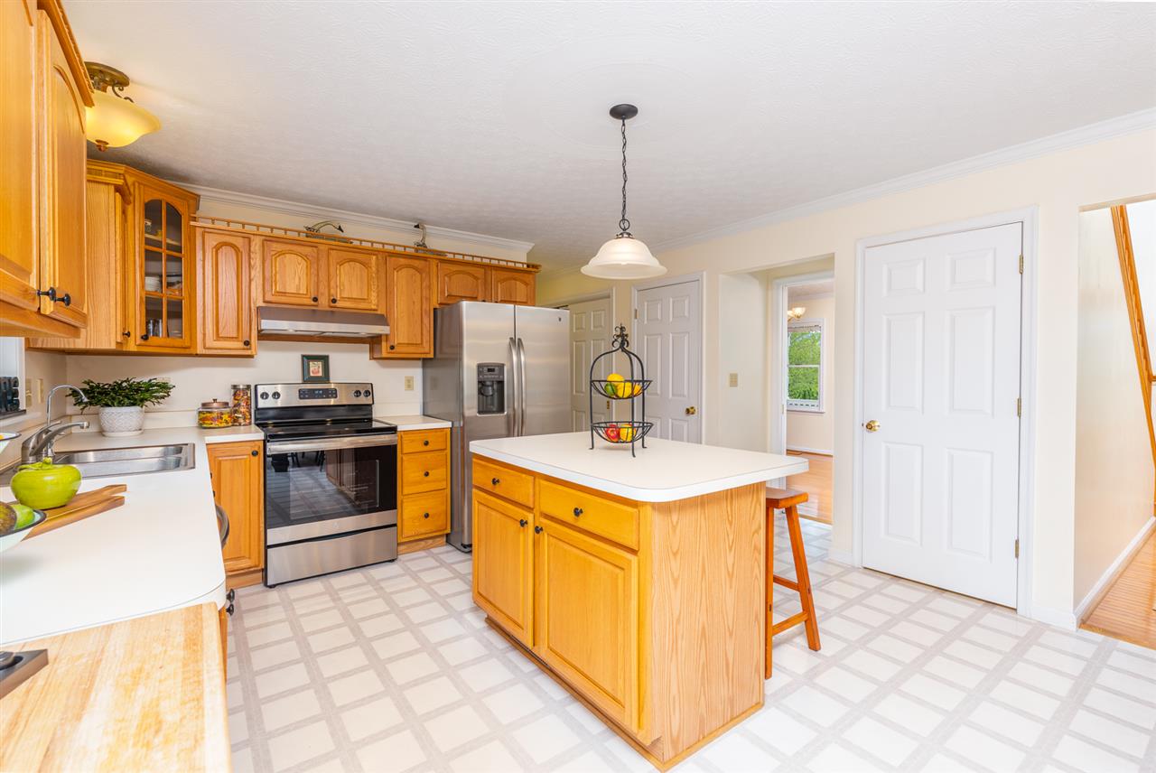 66 Cedar Ridge Road Waynesboro, VA 22980 - Photo 17 of 48 a kitchen with a stove a sink a refrigerator and a window