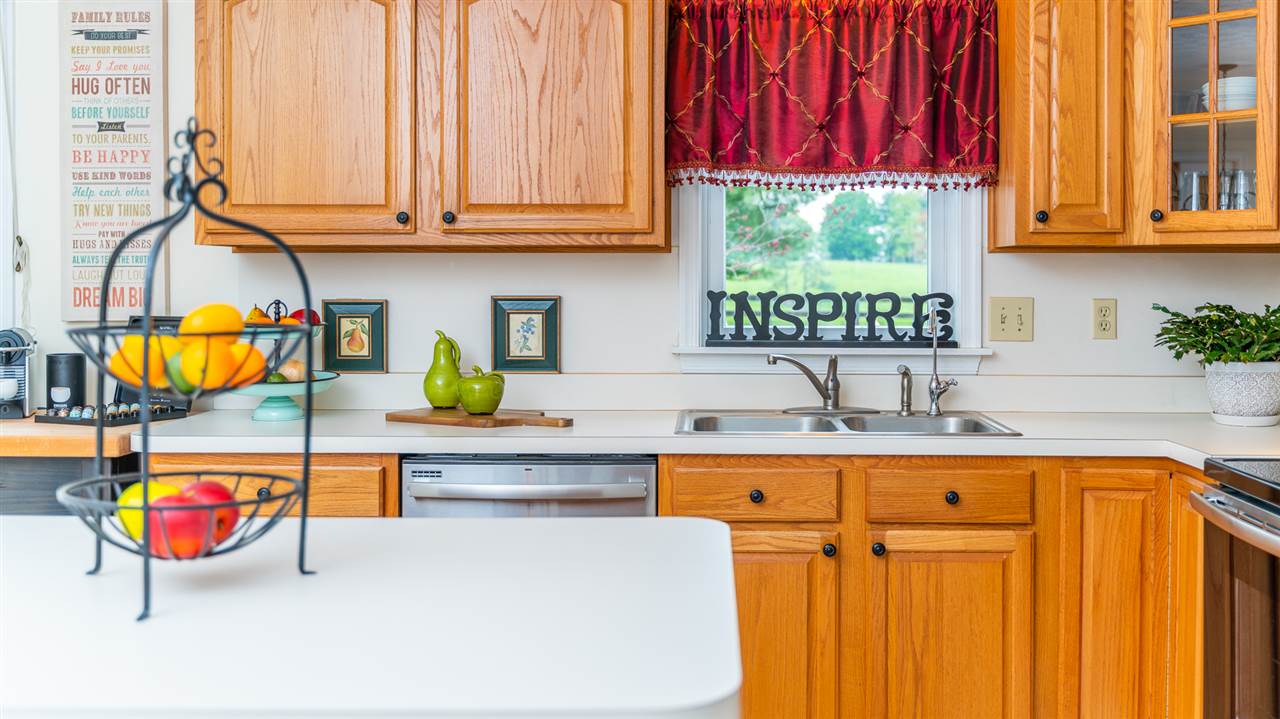 66 Cedar Ridge Road Waynesboro, VA 22980 - Photo 21 of 48 a kitchen with stainless steel appliances granite countertop a sink a dishwasher and cabinets with wooden floor
