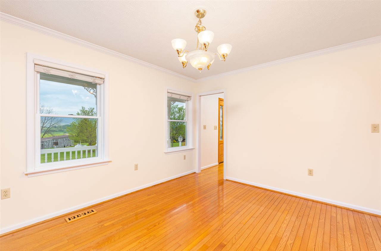 66 Cedar Ridge Road Waynesboro, VA 22980 - Photo 23 of 48 a view of an empty room with wooden floor and a window