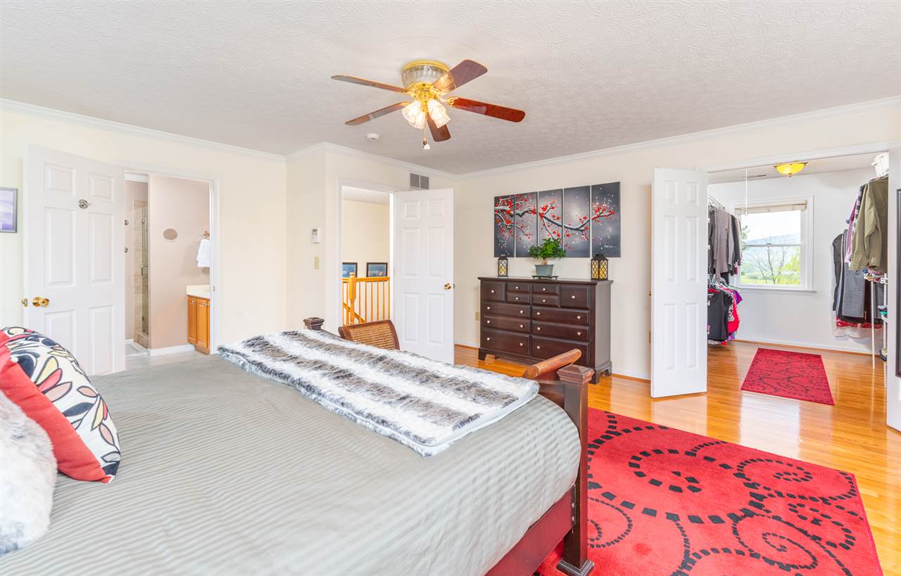 66 Cedar Ridge Road Waynesboro, VA 22980 - Photo 30 of 48 a bedroom with a bed dresser and a flat tv screen