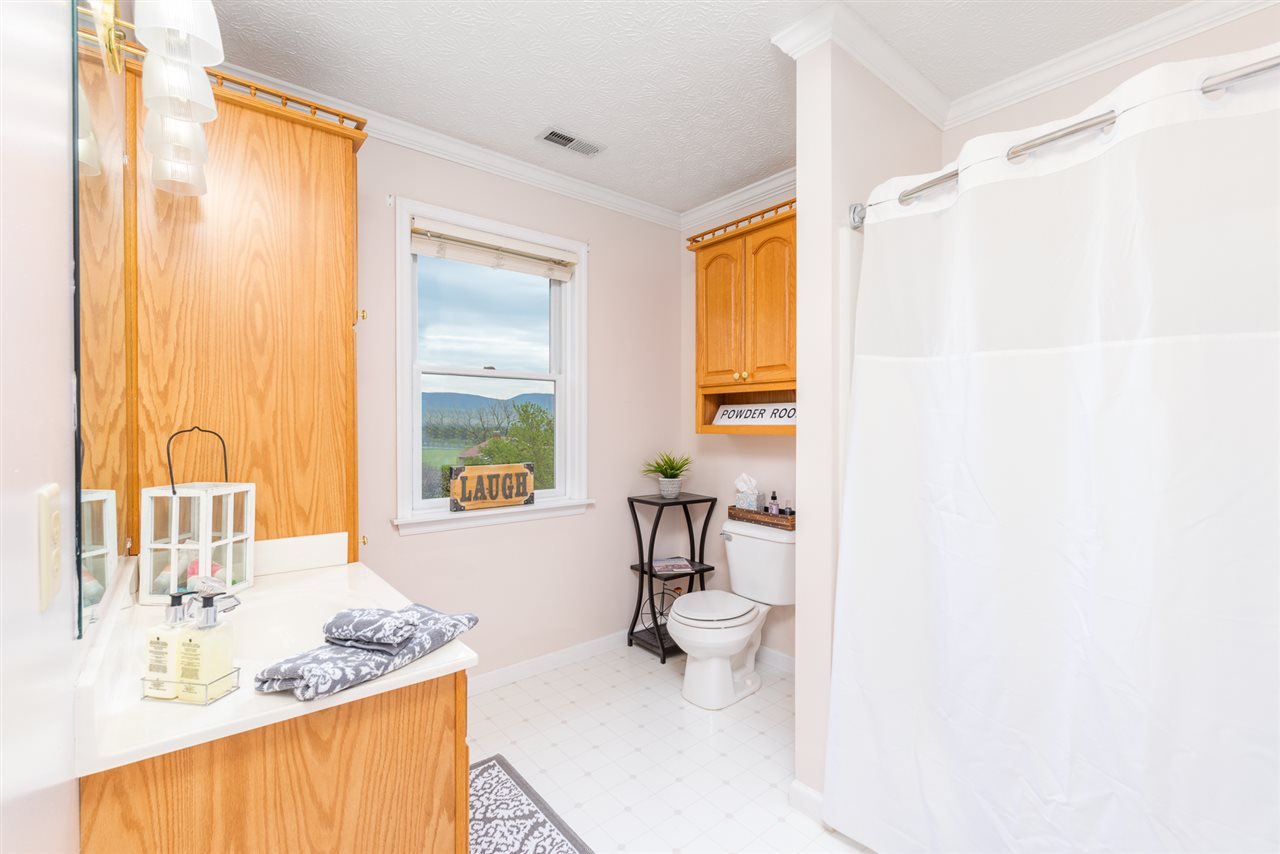 66 Cedar Ridge Road Waynesboro, VA 22980 - Photo 36 of 48 a bathroom with a tub sink and mirror