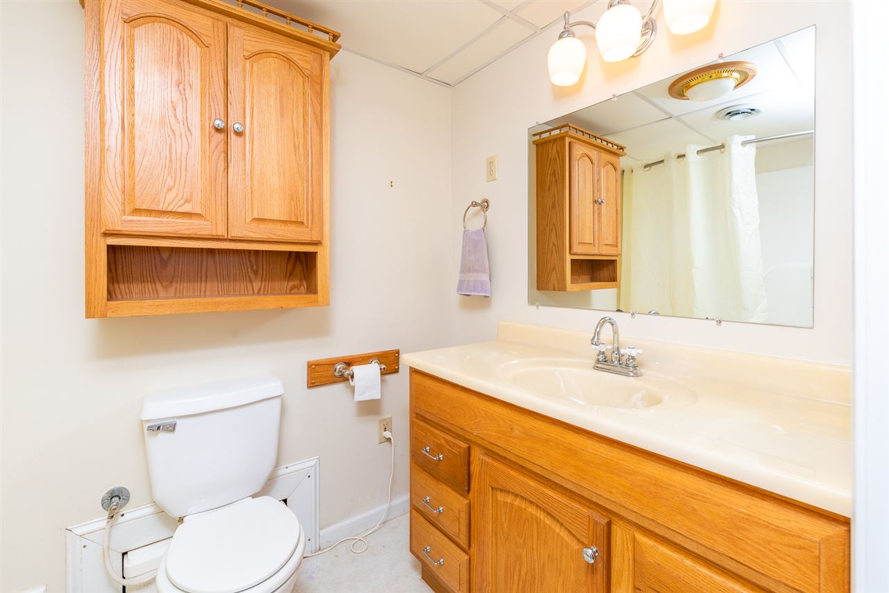 66 Cedar Ridge Road Waynesboro, VA 22980 - Photo 39 of 48 a bathroom with a granite countertop sink mirror vanity and toilet