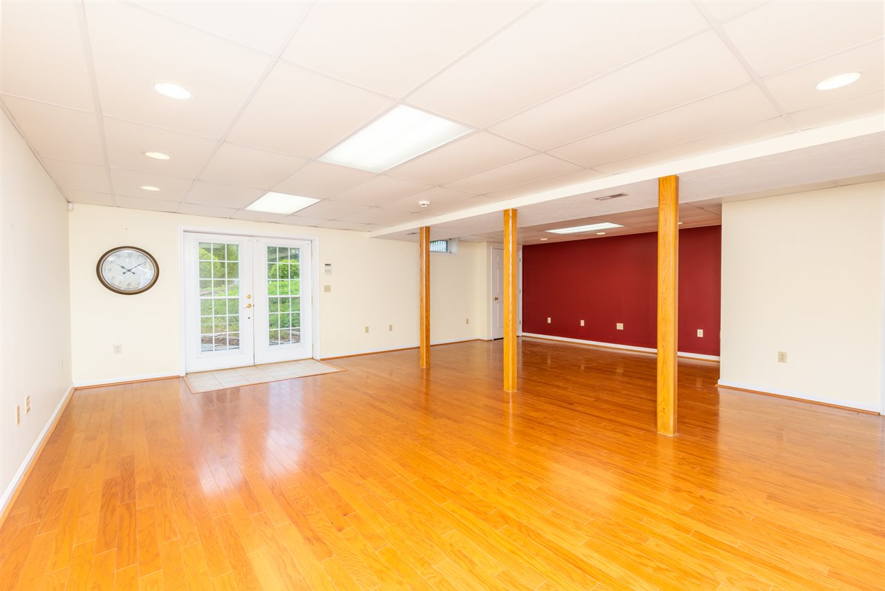 66 Cedar Ridge Road Waynesboro, VA 22980 - Photo 41 of 48 a view of an empty room with window and wooden floor