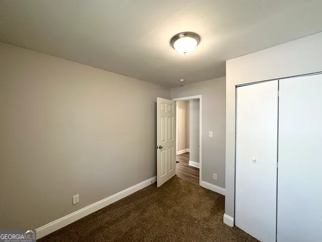 an empty room with a bathroom