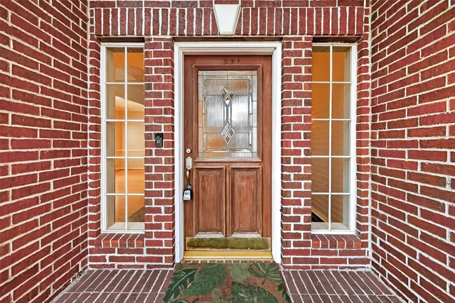 a view of a brick building with many windows