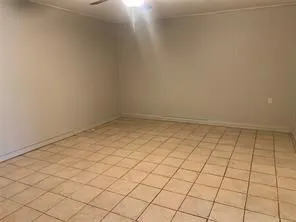 a view of room with window and hardwood floor