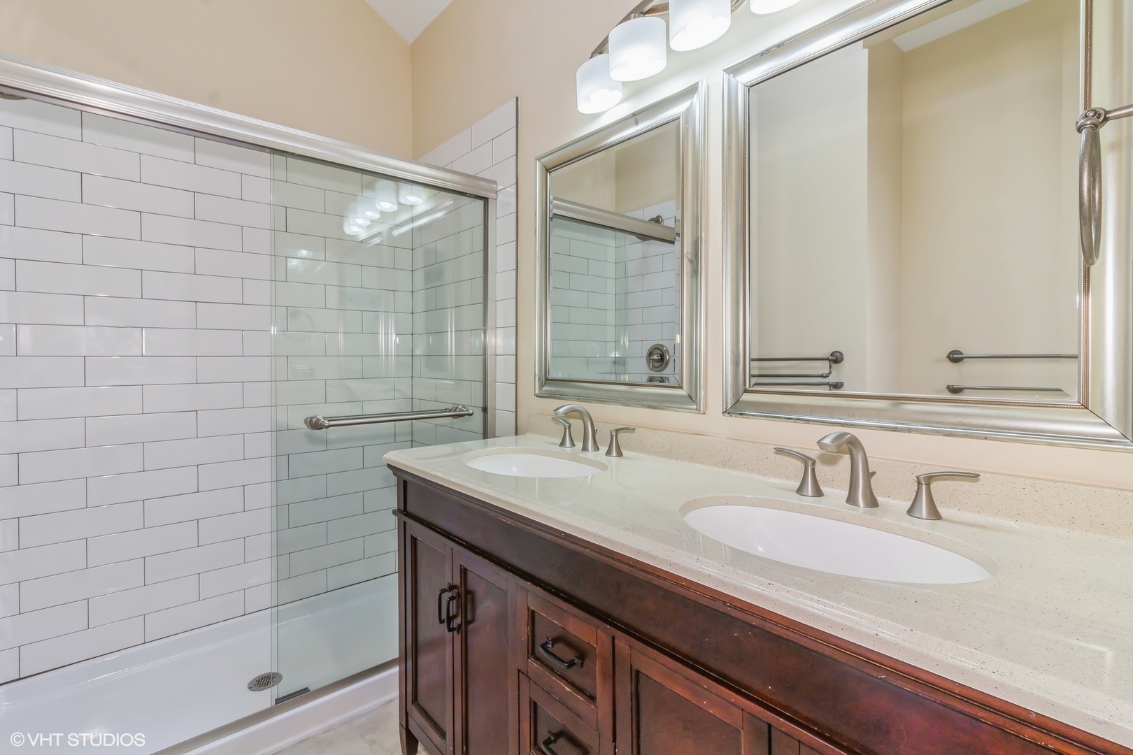 580 Chestnut Drive Oswego, IL 60543 - Photo 9 of 20 a bathroom with a sink shower and a mirror