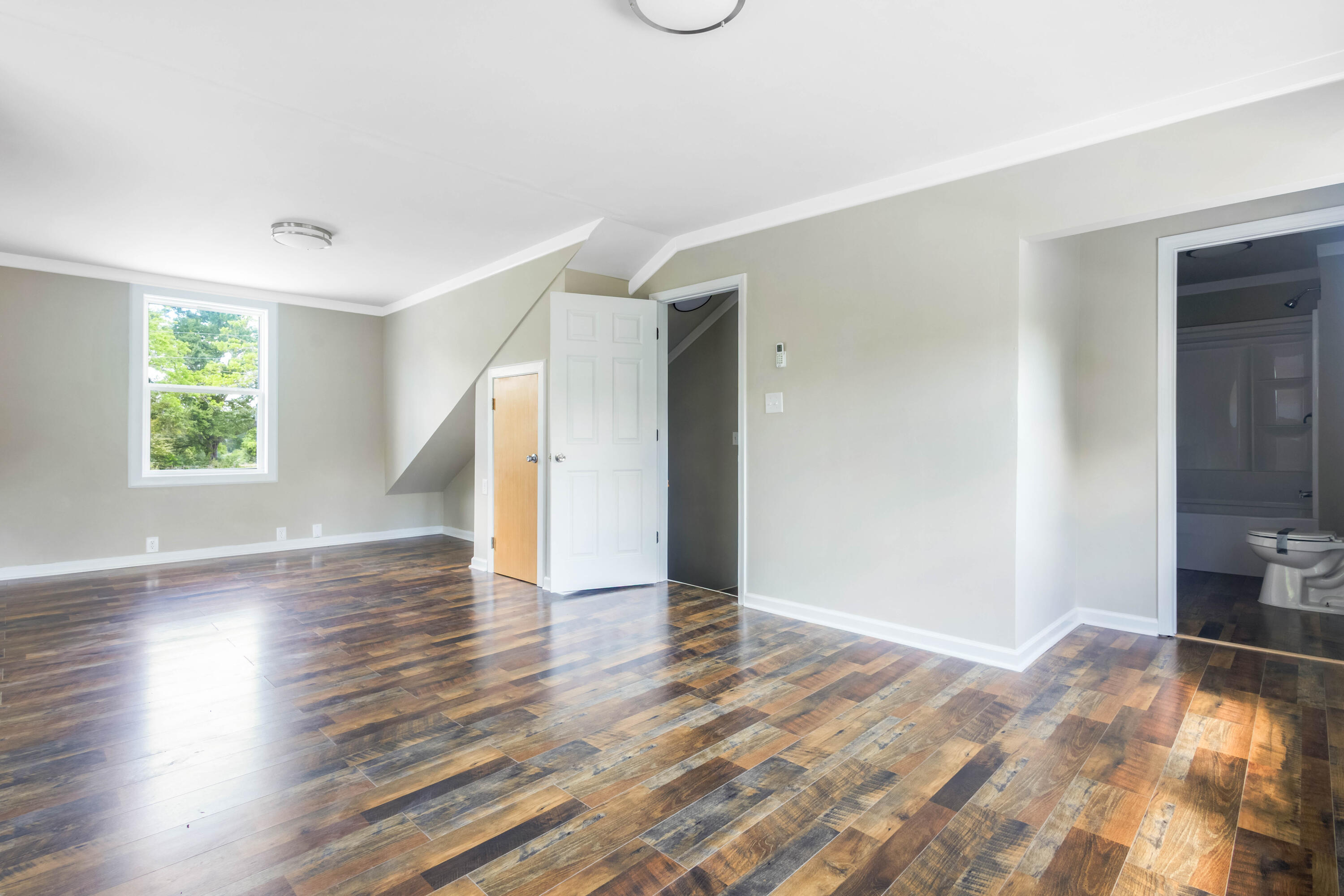 1650 Perkins Road Laurel Hill, FL 32567 - Photo 34 of 47 a view of empty room with wooden floor and fan