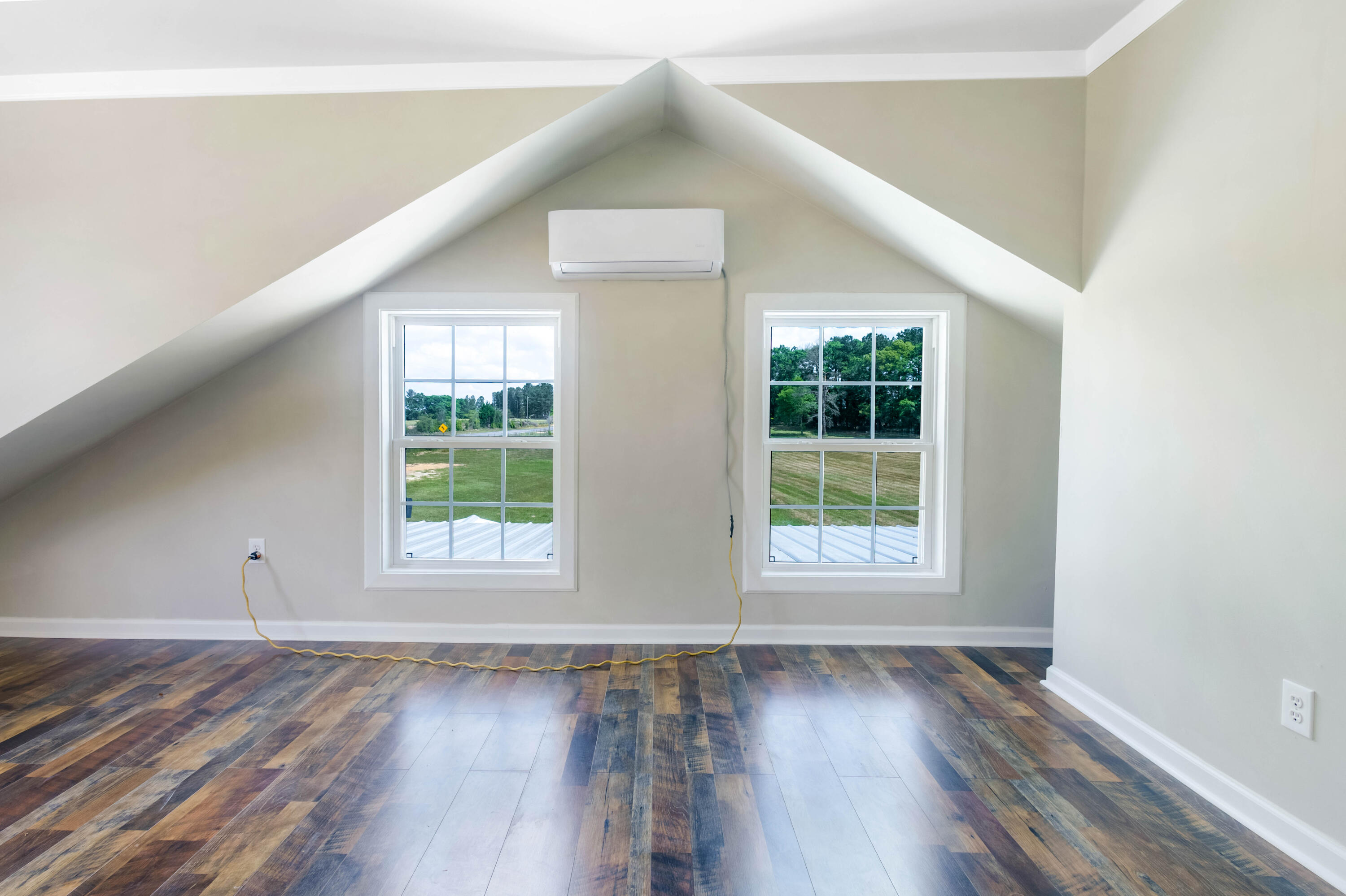 1650 Perkins Road Laurel Hill, FL 32567 - Photo 37 of 47 an empty room with wooden floor and windows