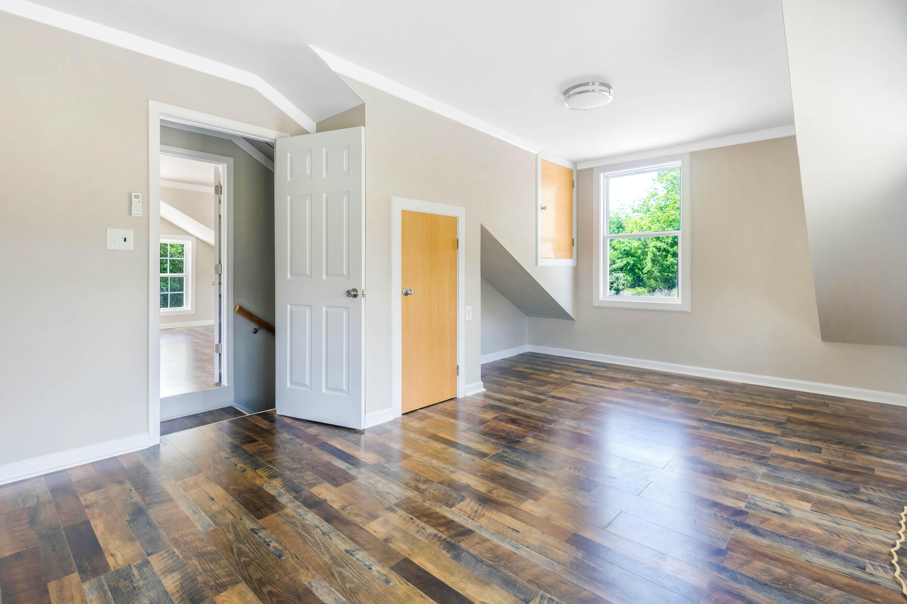1650 Perkins Road Laurel Hill, FL 32567 - Photo 39 of 47 an empty room with wooden floor and windows