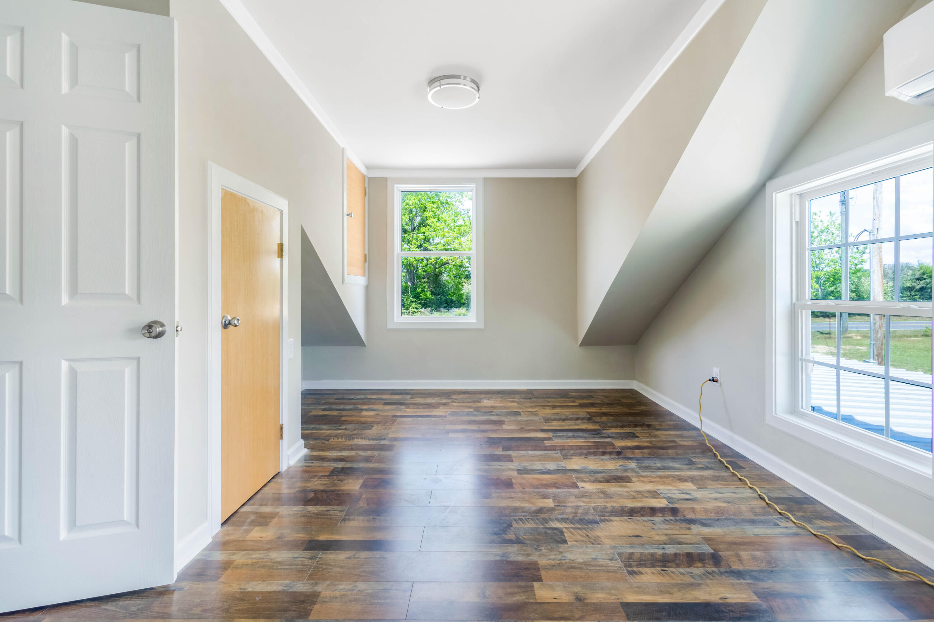 1650 Perkins Road Laurel Hill, FL 32567 - Photo 40 of 47 a view of an empty room with wooden floor and a window