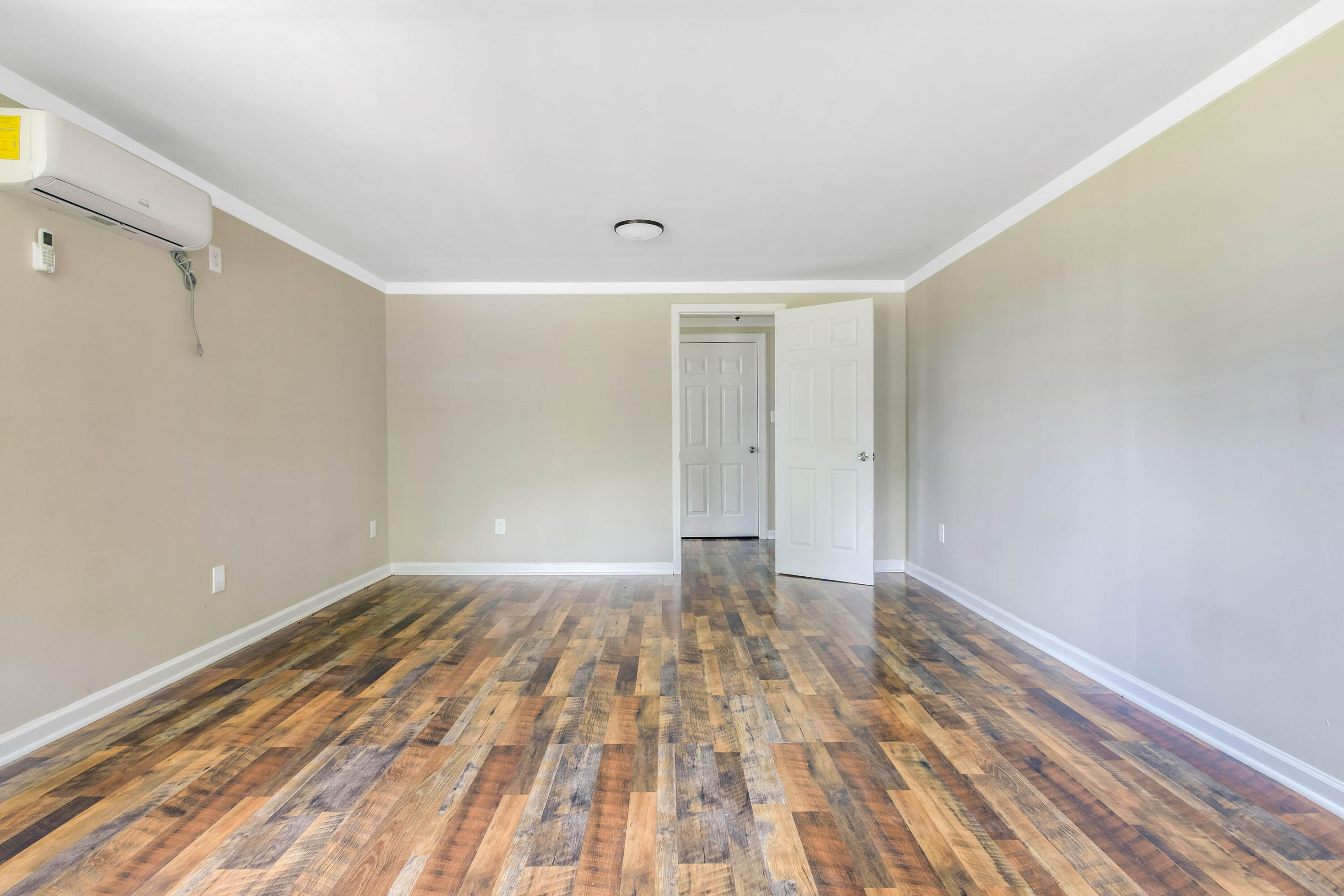 1650 Perkins Road Laurel Hill, FL 32567 - Photo 43 of 47 a view of an empty room with wooden floor and a window