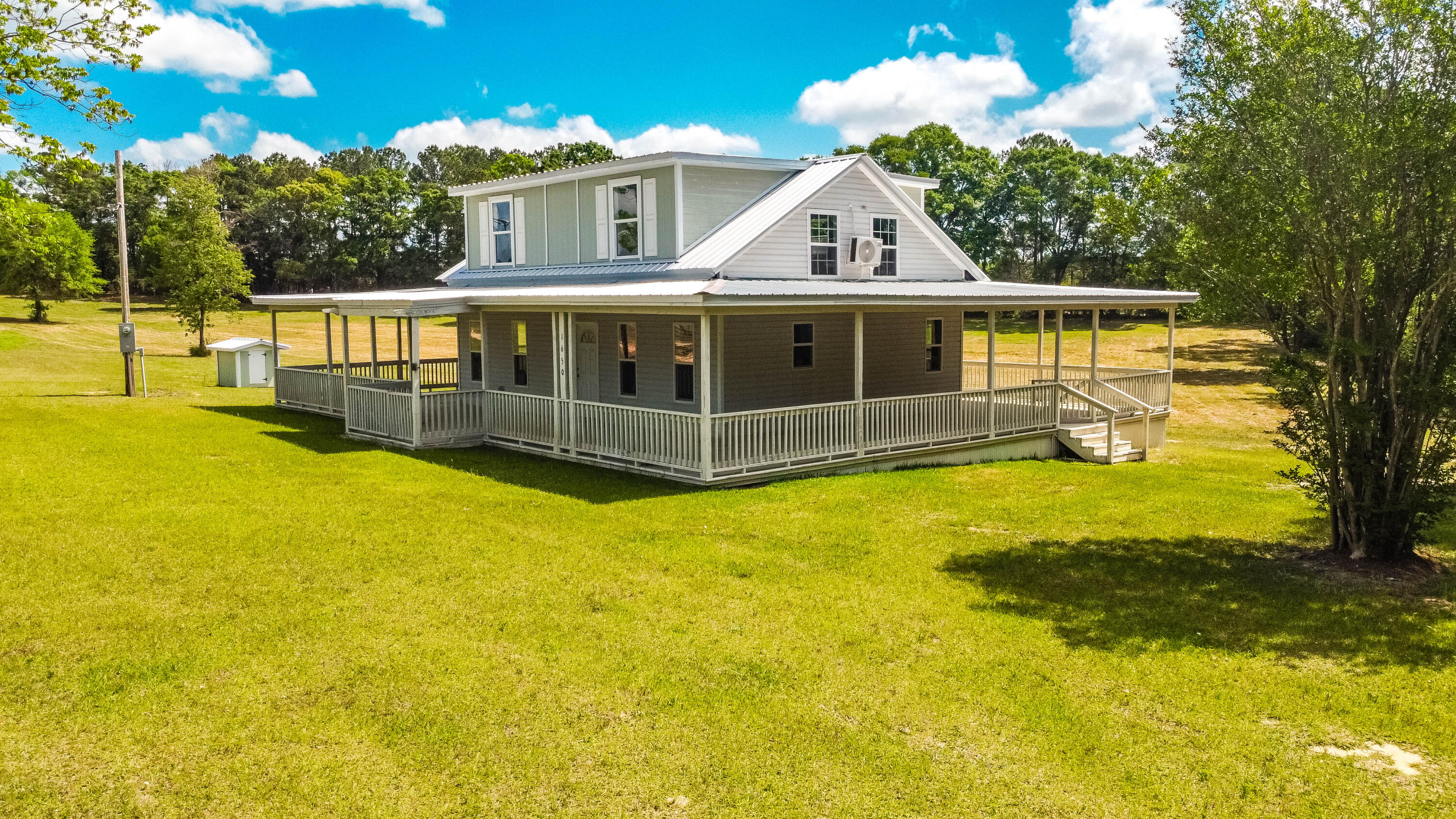 1650 Perkins Road Laurel Hill, FL 32567 - Photo 7 of 47 a front view of a house with swimming pool