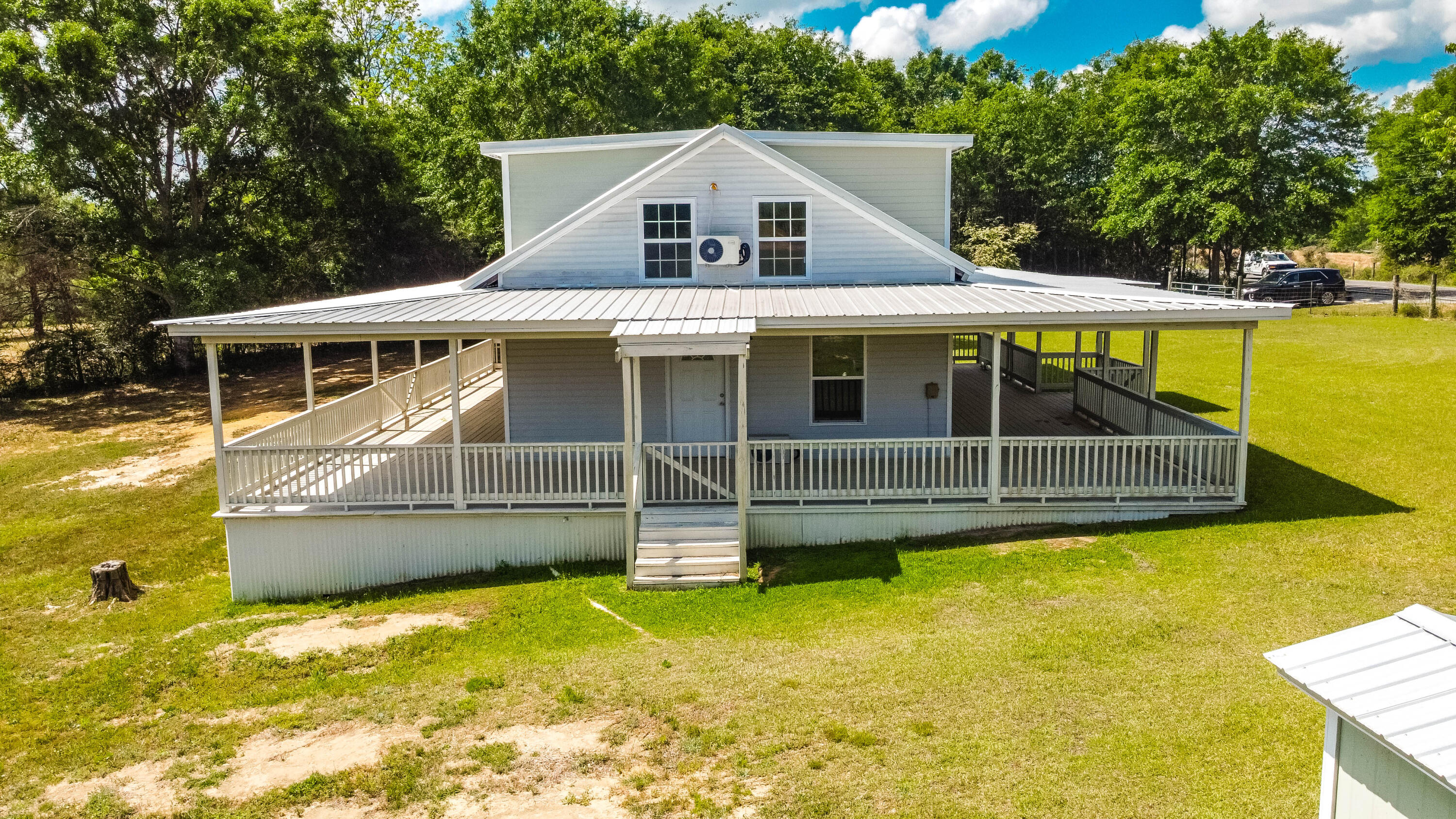 1650 Perkins Road Laurel Hill, FL 32567 - Photo 9 of 47 a view of a house with a yard balcony and swimming pool