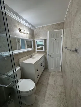 $180,000 | 8040 Tatum Waterway Drive, Unit 3, Miami Beach, FL 33141
