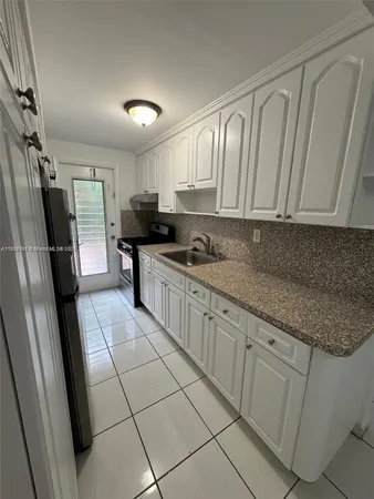 $180,000 | 8040 Tatum Waterway Drive, Unit 3, Miami Beach, FL 33141