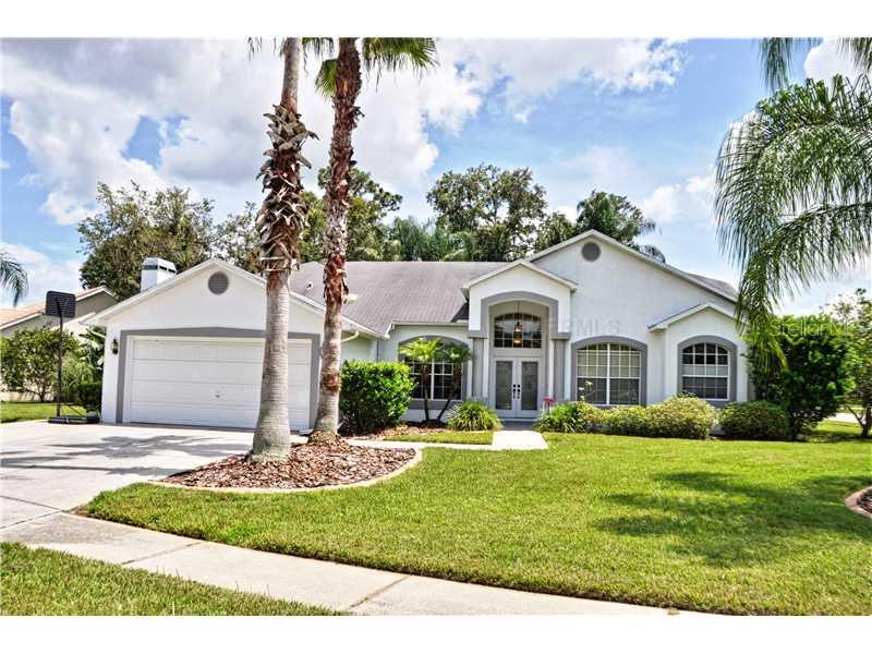 10026 Hermosillo Drive New Port Richey, FL 34655 - Photo 1 of 1 Exterior Front - Beautiful curb appeal on nearly 1/3 acre lot. Nearly 20 gorgeous flowing palm trees make this home your own private paradise.
