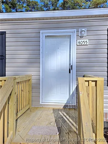 a view of a wooden door of the house