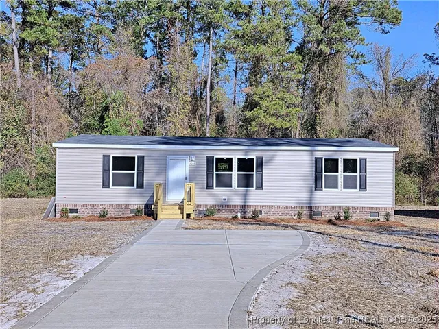 front view of a house with a patio