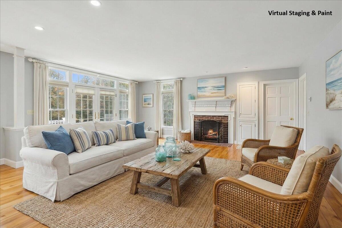 46 Freeman Lane Orleans, MA 02653 - Photo 15 of 74 a living room with furniture and a fireplace