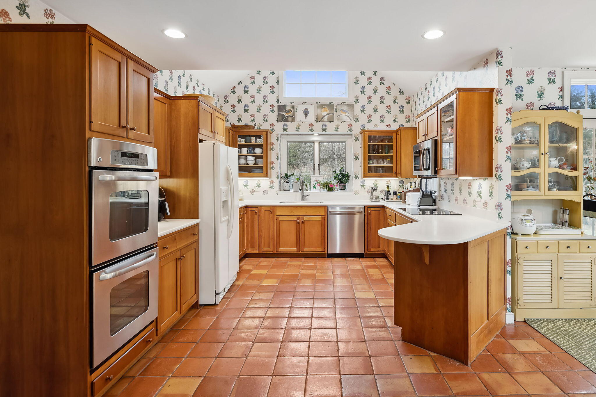 46 Freeman Lane Orleans, MA 02653 - Photo 22 of 74 a kitchen with stainless steel appliances a sink cabinets and wooden floor