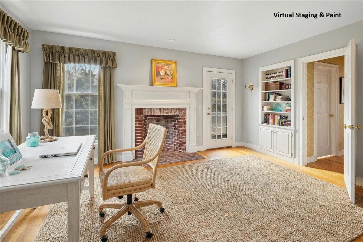 46 Freeman Lane Orleans, MA 02653 - Photo 25 of 74 a view of a livingroom with furniture and a fireplace