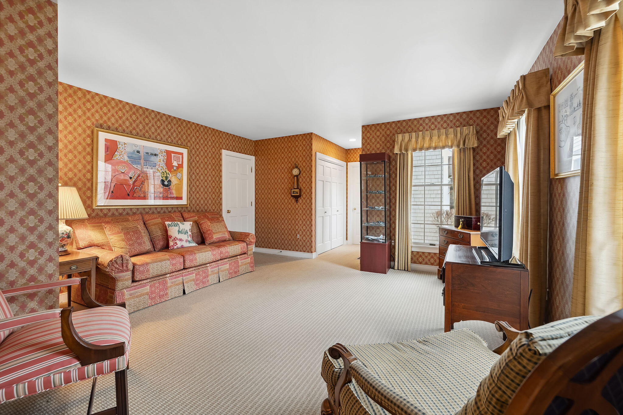 46 Freeman Lane Orleans, MA 02653 - Photo 27 of 74 a living room with furniture and large windows