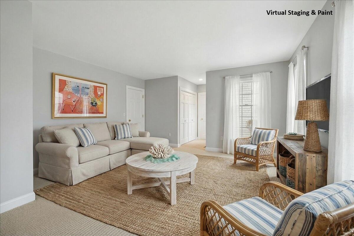 46 Freeman Lane Orleans, MA 02653 - Photo 28 of 74 a living room with furniture and a fireplace