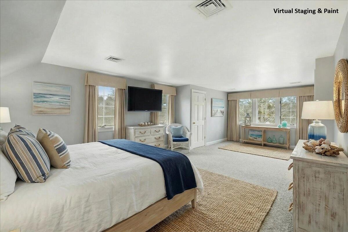 46 Freeman Lane Orleans, MA 02653 - Photo 32 of 74 a bedroom with a bed and glass door