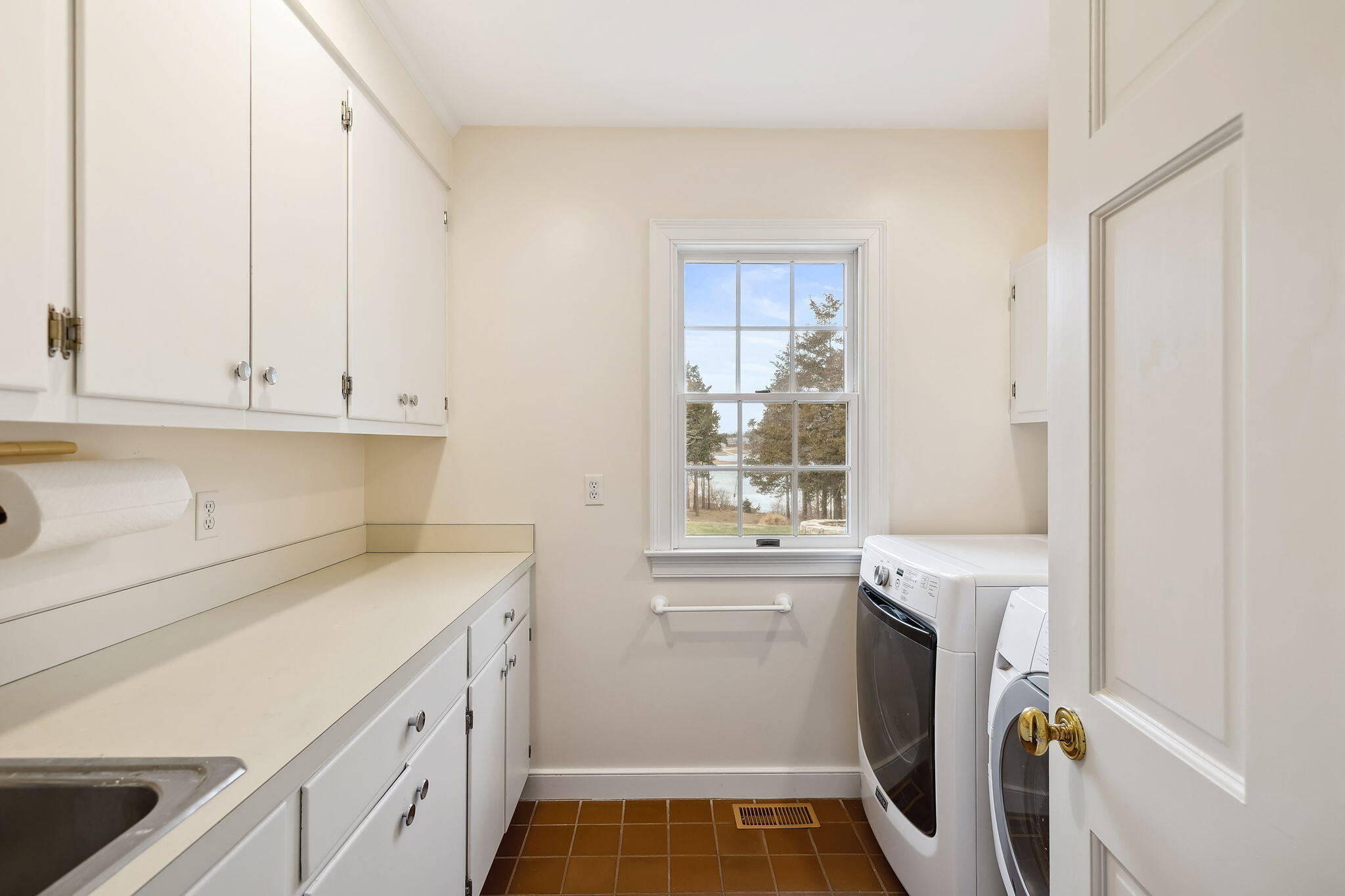 46 Freeman Lane Orleans, MA 02653 - Photo 44 of 74 a view of a kitchen with sink dryer and washer
