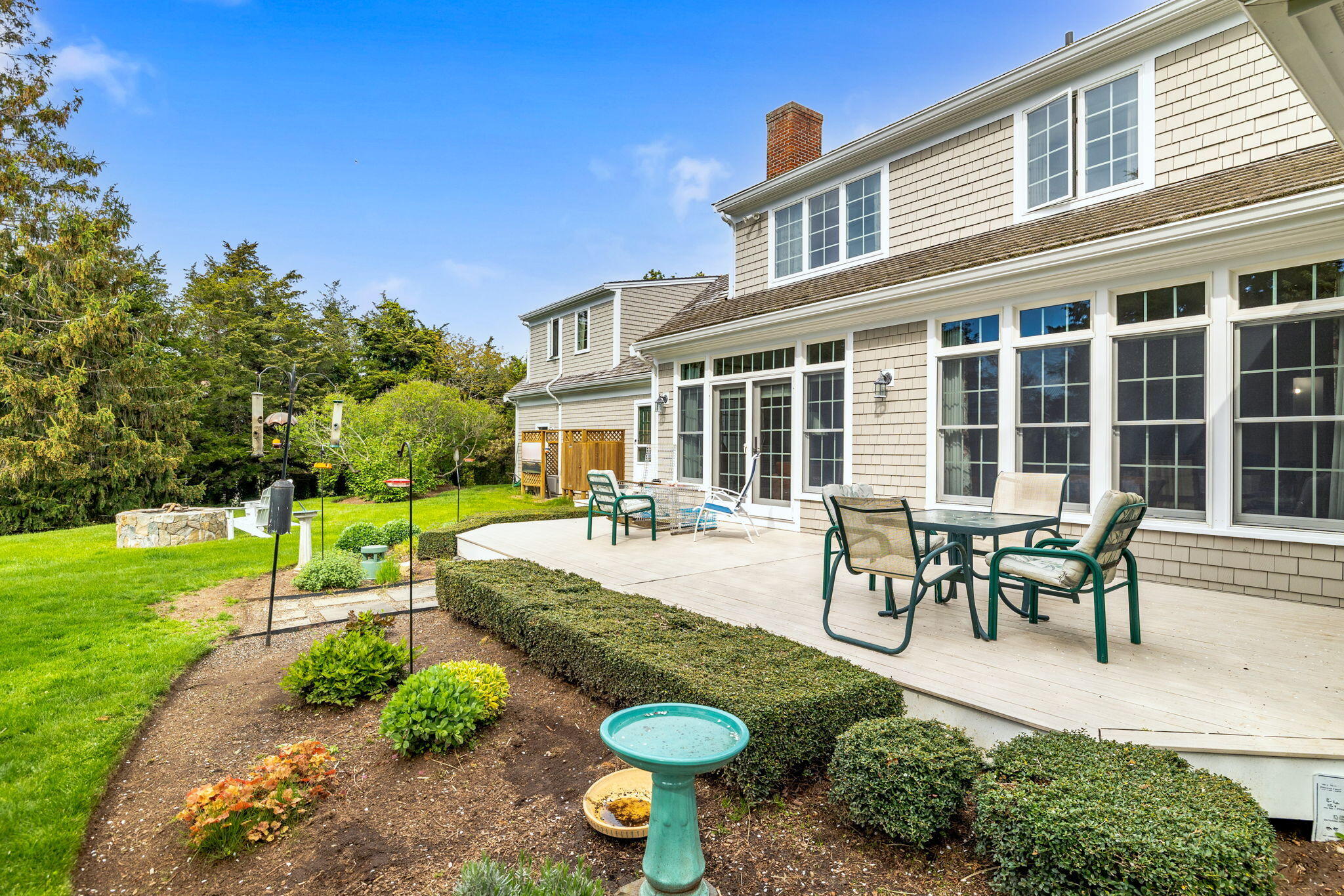 46 Freeman Lane Orleans, MA 02653 - Photo 47 of 74 a view of a house with backyard sitting area and garden