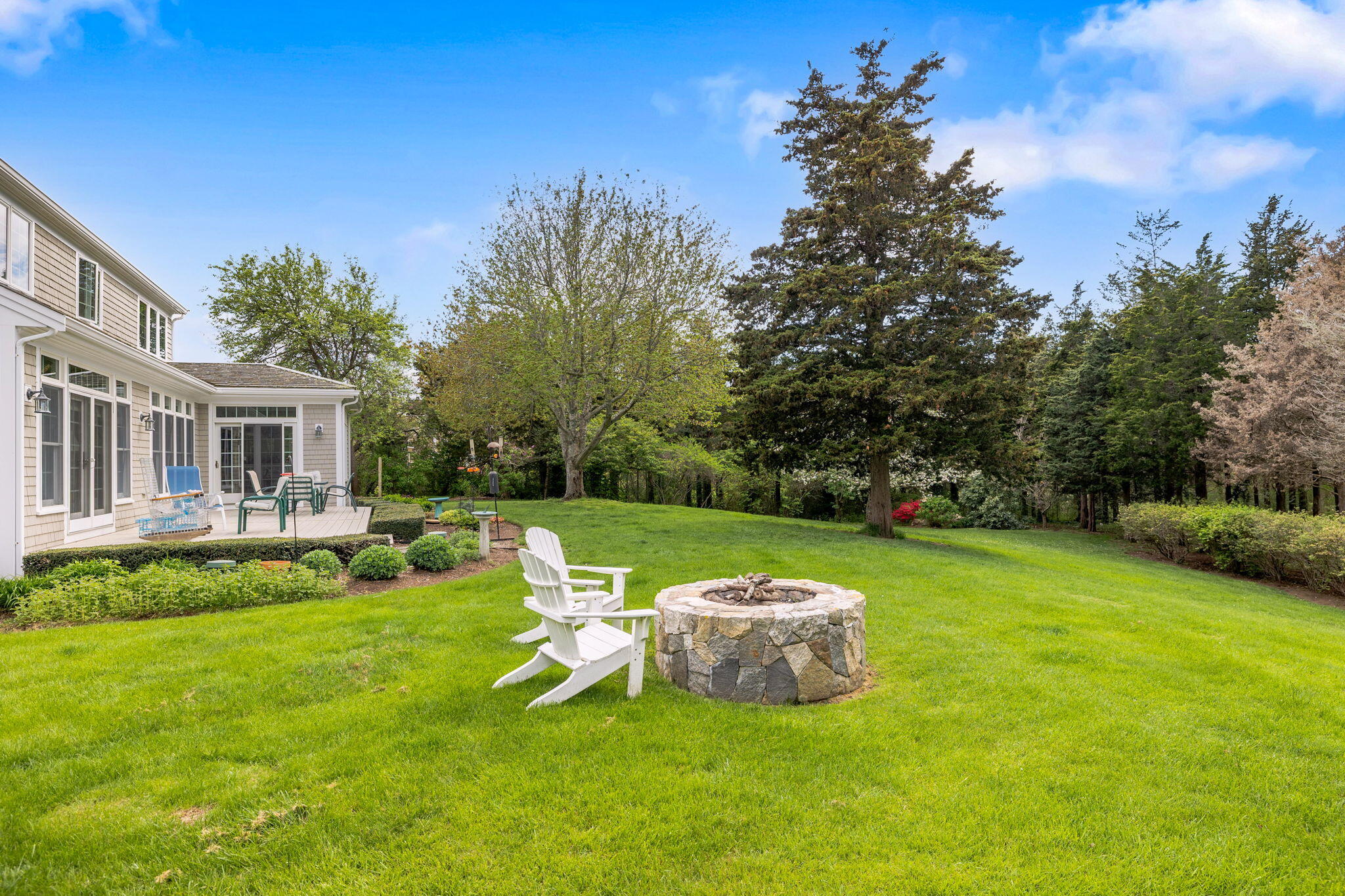 46 Freeman Lane Orleans, MA 02653 - Photo 53 of 74 a view of a house with backyard sitting area and garden