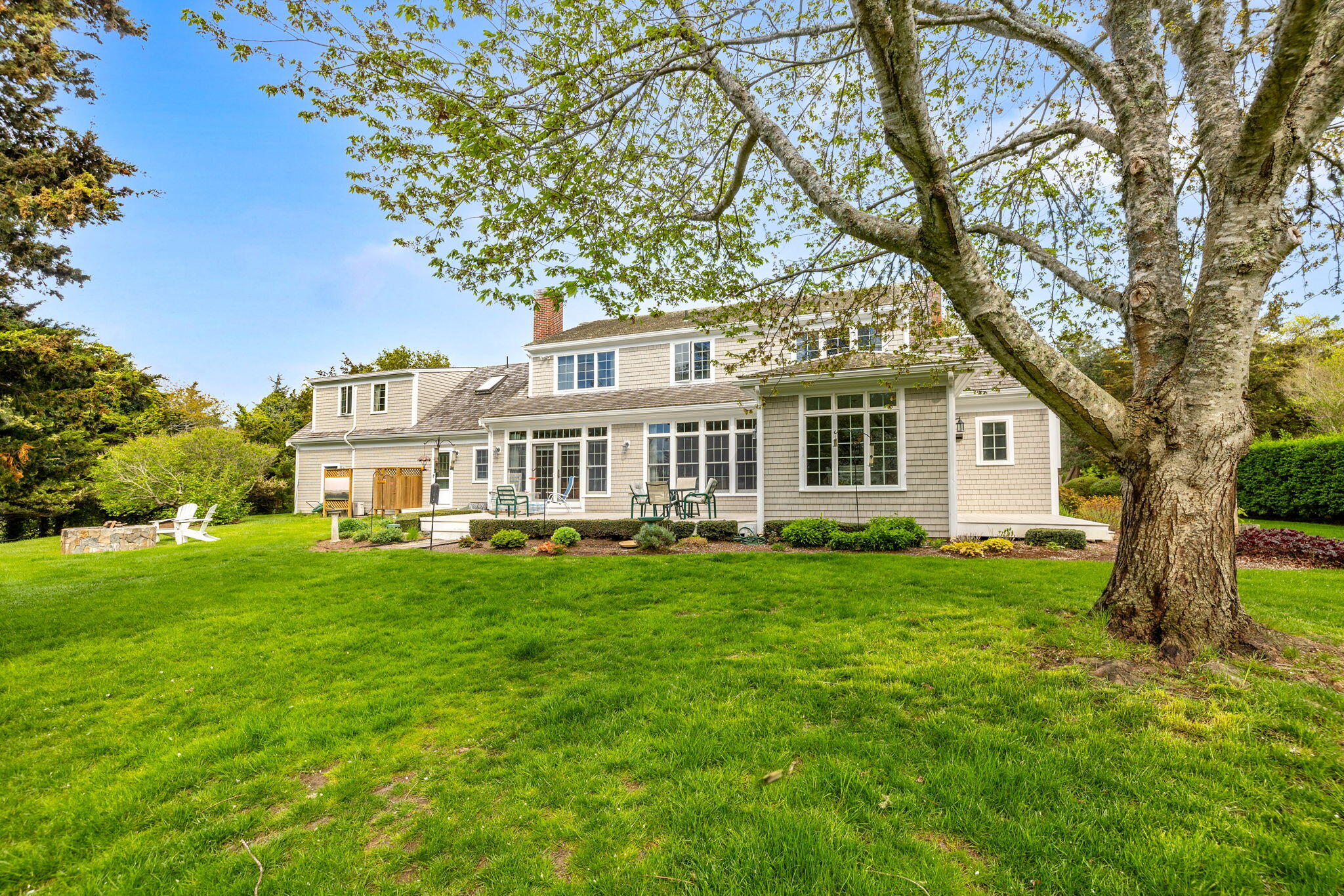 46 Freeman Lane Orleans, MA 02653 - Photo 54 of 74 a house view with a garden space