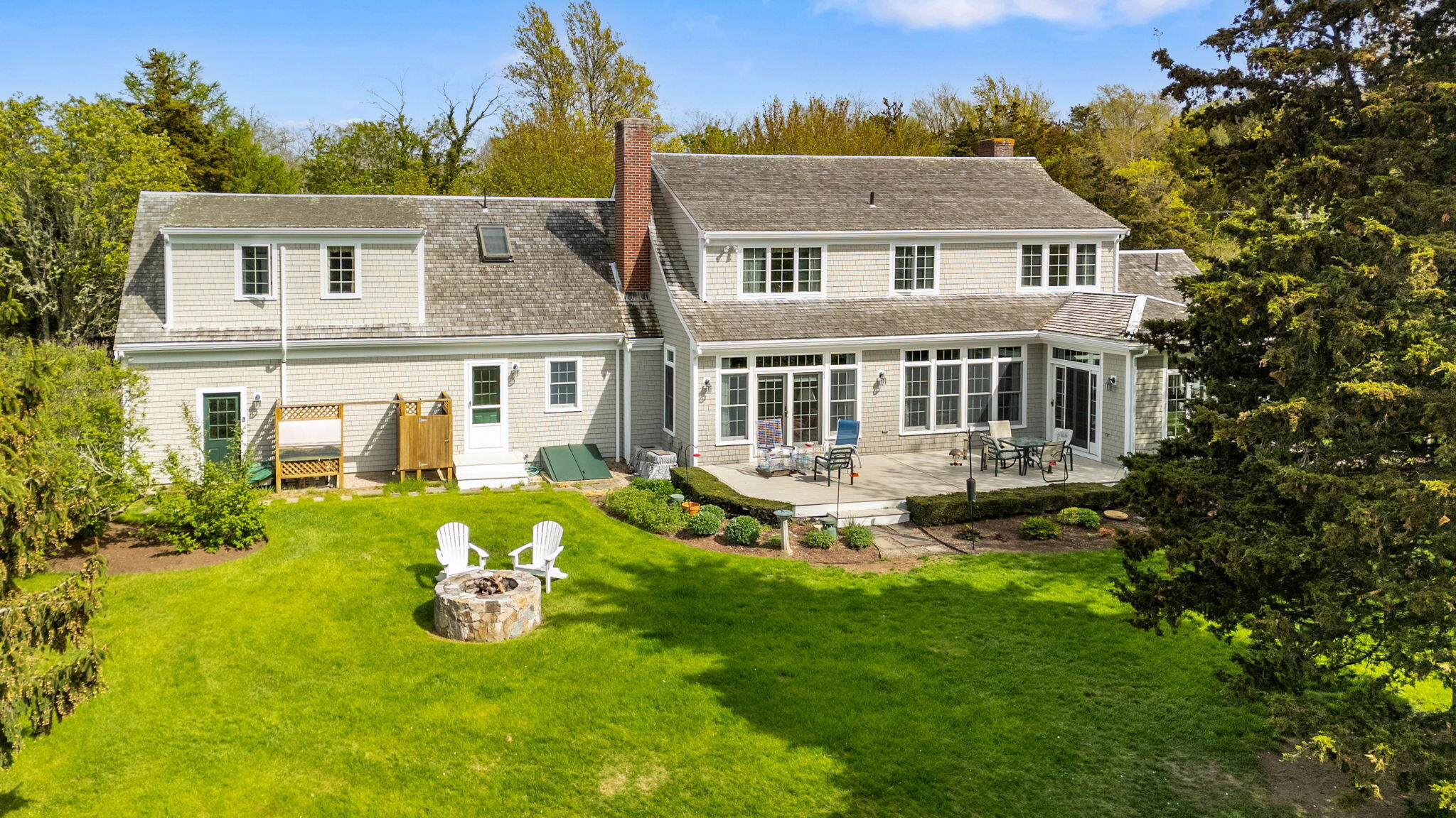 46 Freeman Lane Orleans, MA 02653 - Photo 59 of 74 a view of a house with a backyard