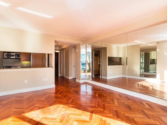 a view of a living room with kitchen island