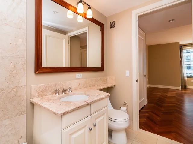 a bathroom with a sink a toilet and a bathtub