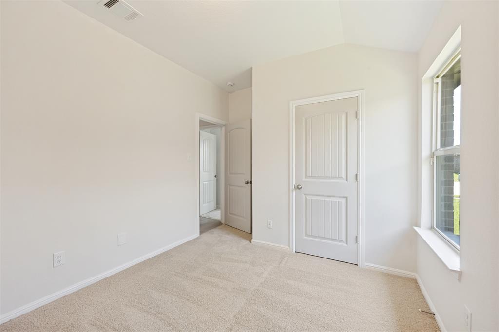 857 Watson Way Crowley, TX 76036 - Photo 15 of 25 Carpeted interior room with neutral wall tones and a vaulted ceiling