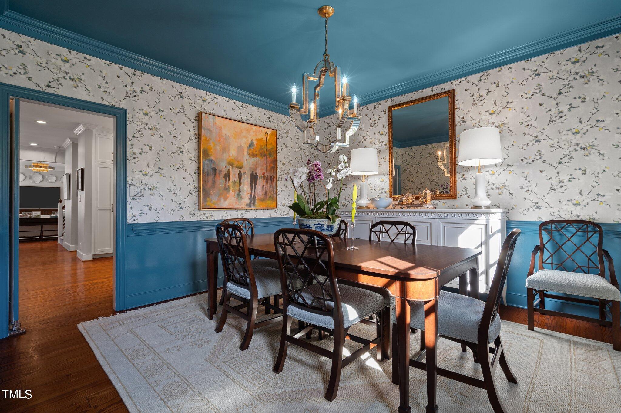 2335 Hales Road Raleigh, NC 27608 - Photo 18 of 65 a view of a dining room with furniture and wooden floor