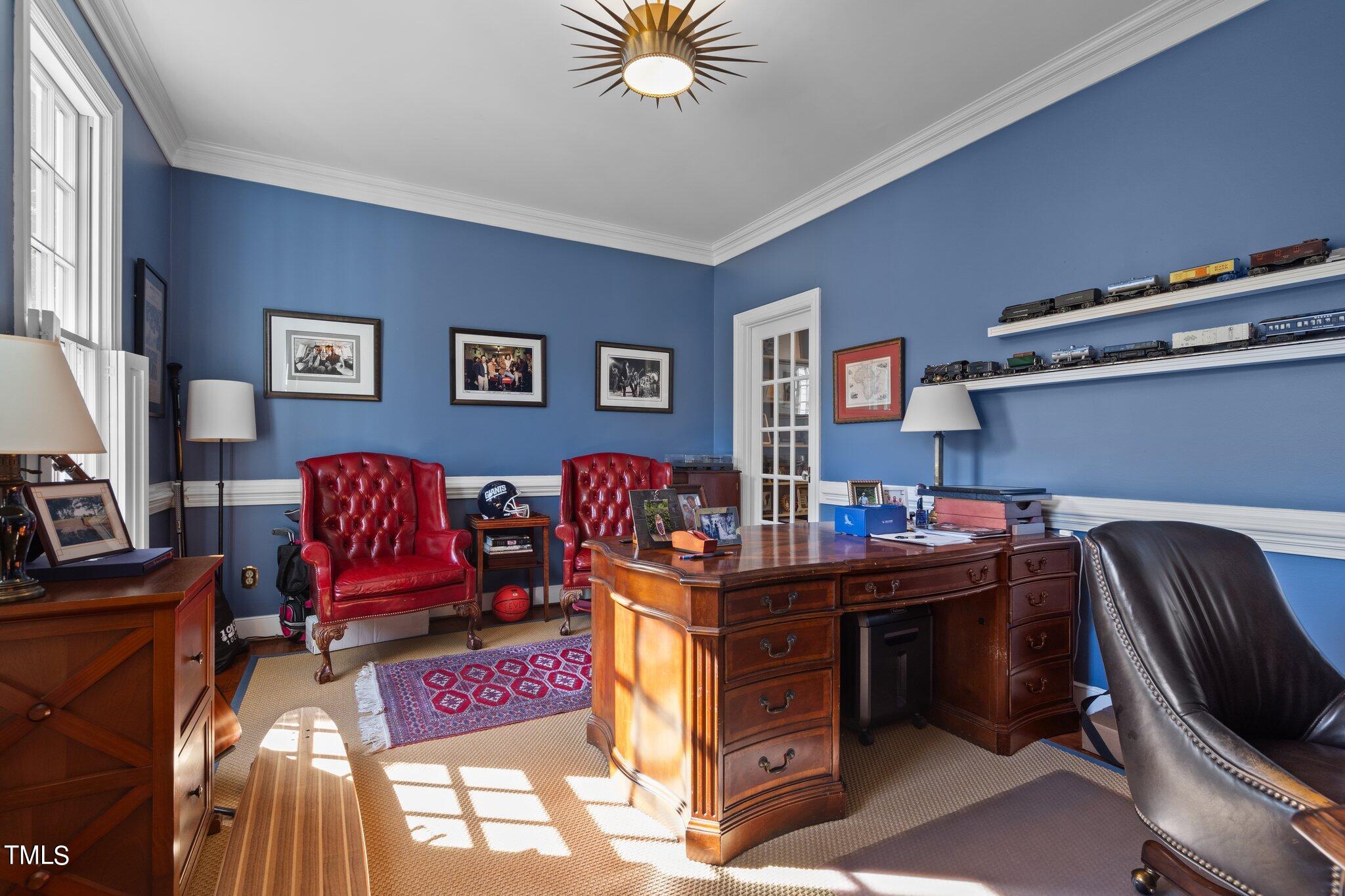 2335 Hales Road Raleigh, NC 27608 - Photo 20 of 65 a view of a workspace with furniture and a window
