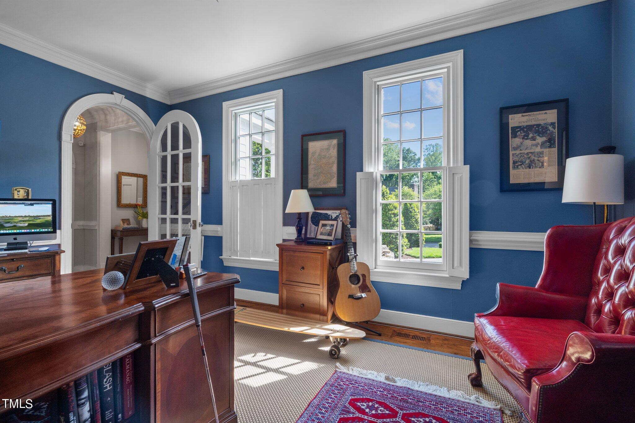 2335 Hales Road Raleigh, NC 27608 - Photo 21 of 65 a view of a livingroom with workspace and a window