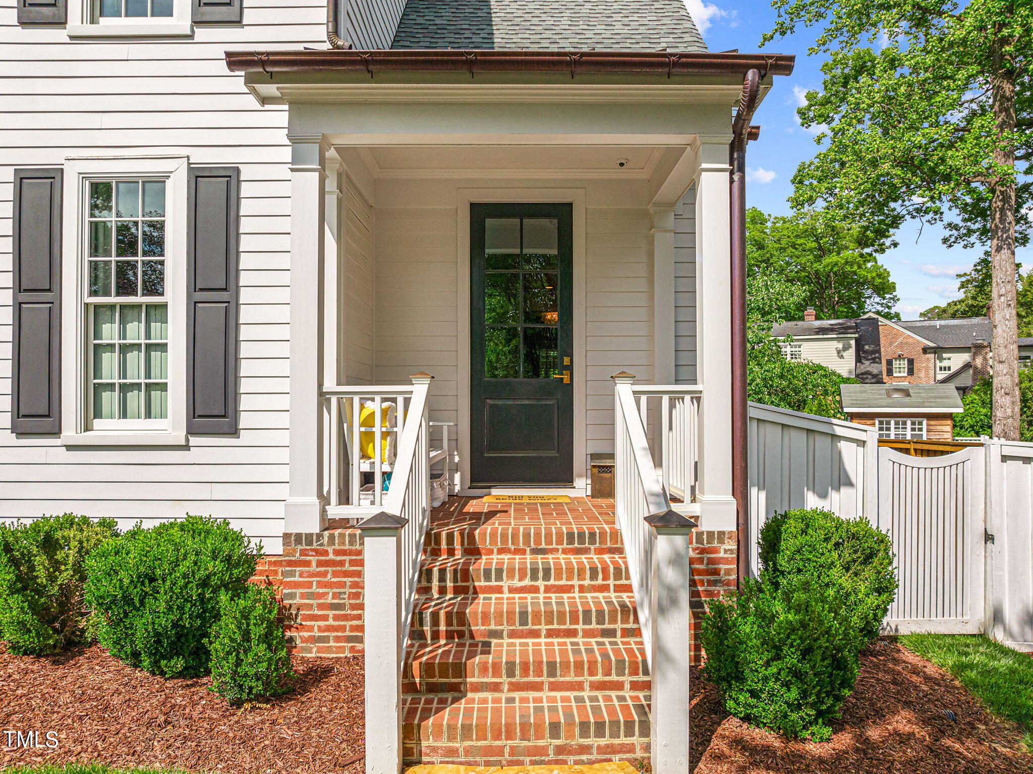 2335 Hales Road Raleigh, NC 27608 - Photo 3 of 65 a front view of a house with a garden