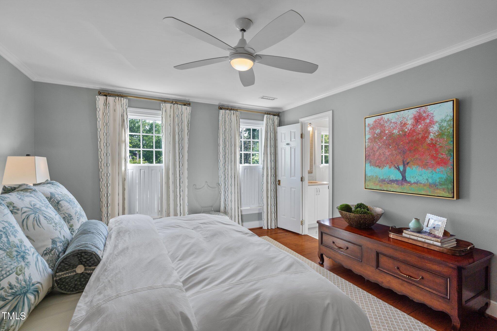2335 Hales Road Raleigh, NC 27608 - Photo 46 of 65 a bed room with a bed and a painting on the wall