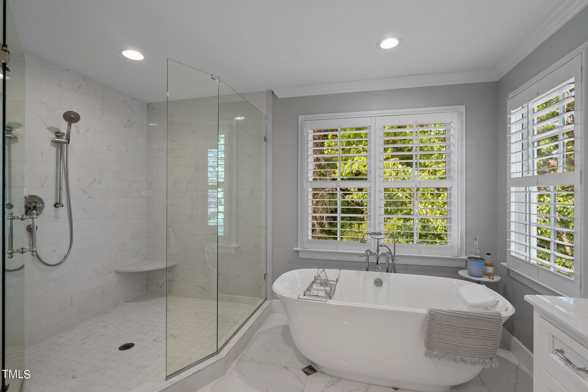 2335 Hales Road Raleigh, NC 27608 - Photo 60 of 65 a spacious bathroom with a tub and a shower