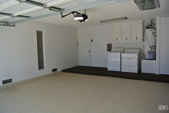 a bedroom with a bed and cabinets