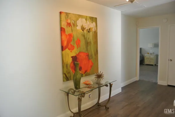 an entryway with wooden floor