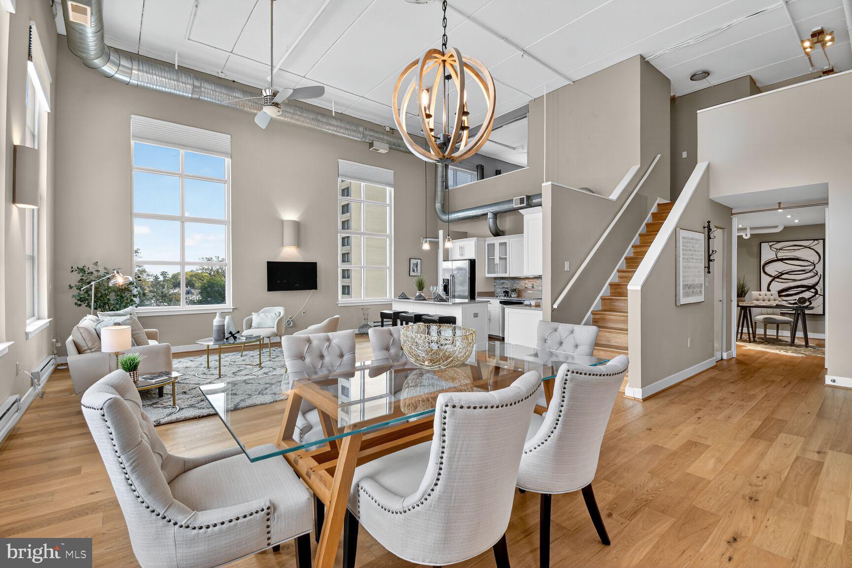 900 Bonifant Street, Unit D Silver Spring, MD 20910 - Photo 19 of 54 a view of a dining room with furniture wooden floor and a chandelier