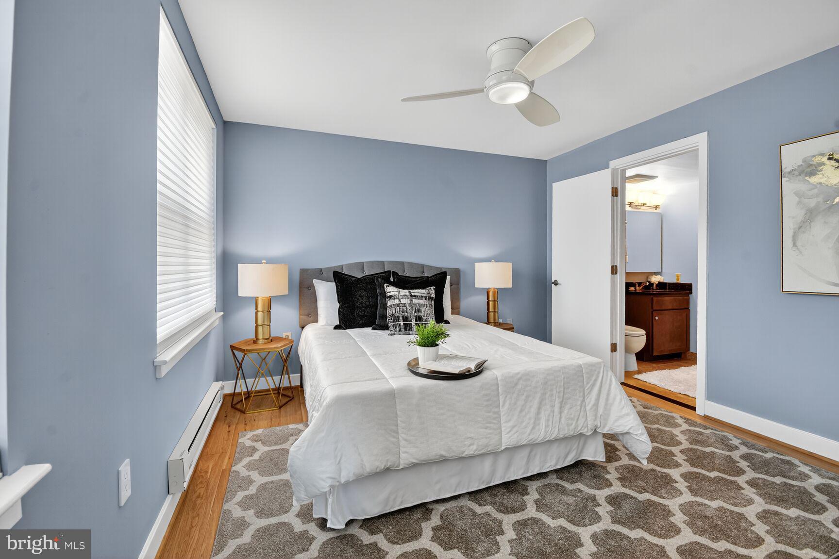 900 Bonifant Street, Unit D Silver Spring, MD 20910 - Photo 23 of 54 a bed sitting in a bedroom and table