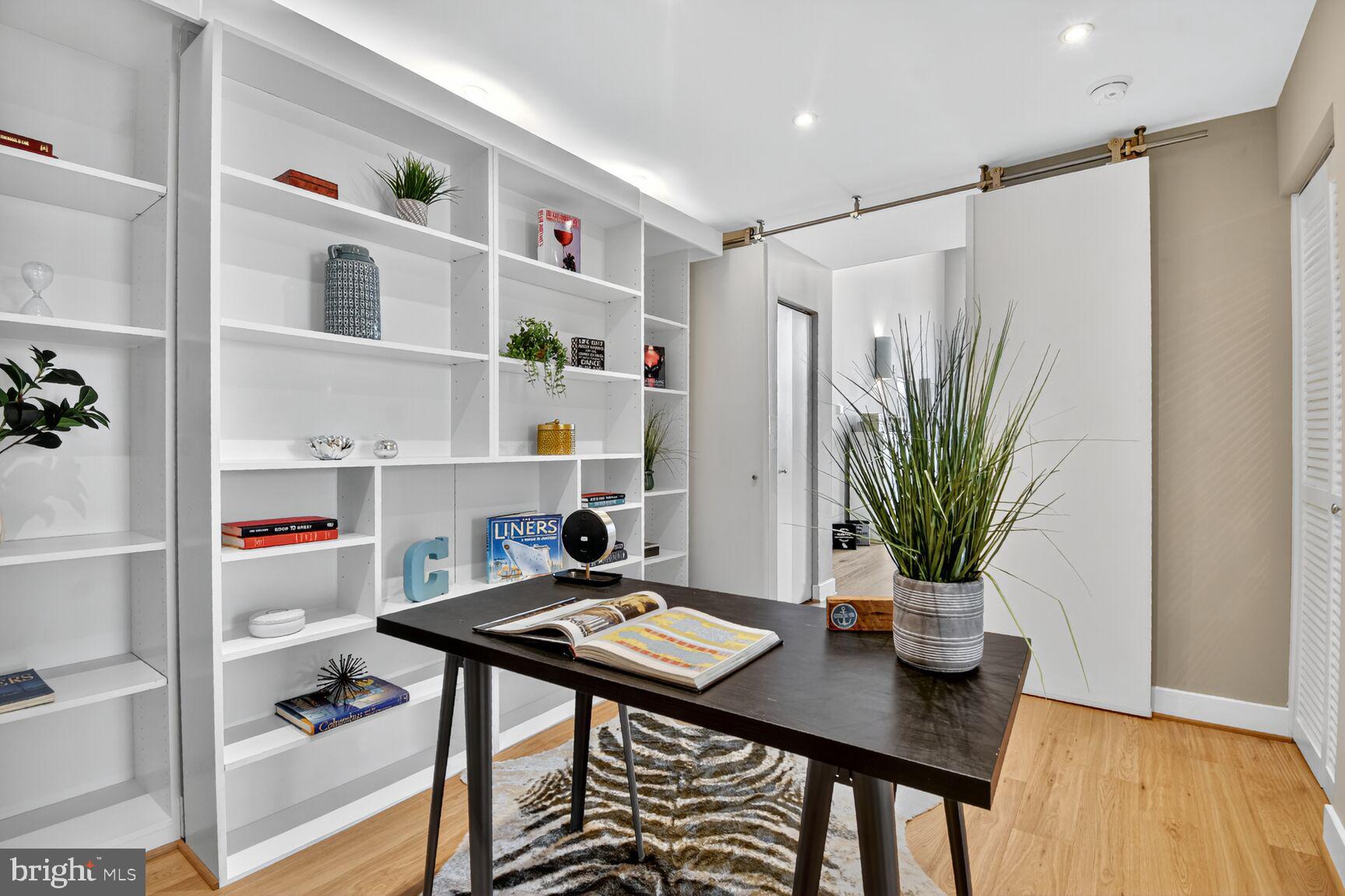 900 Bonifant Street, Unit D Silver Spring, MD 20910 - Photo 25 of 54 a view of a workspace with furniture and wooden floor