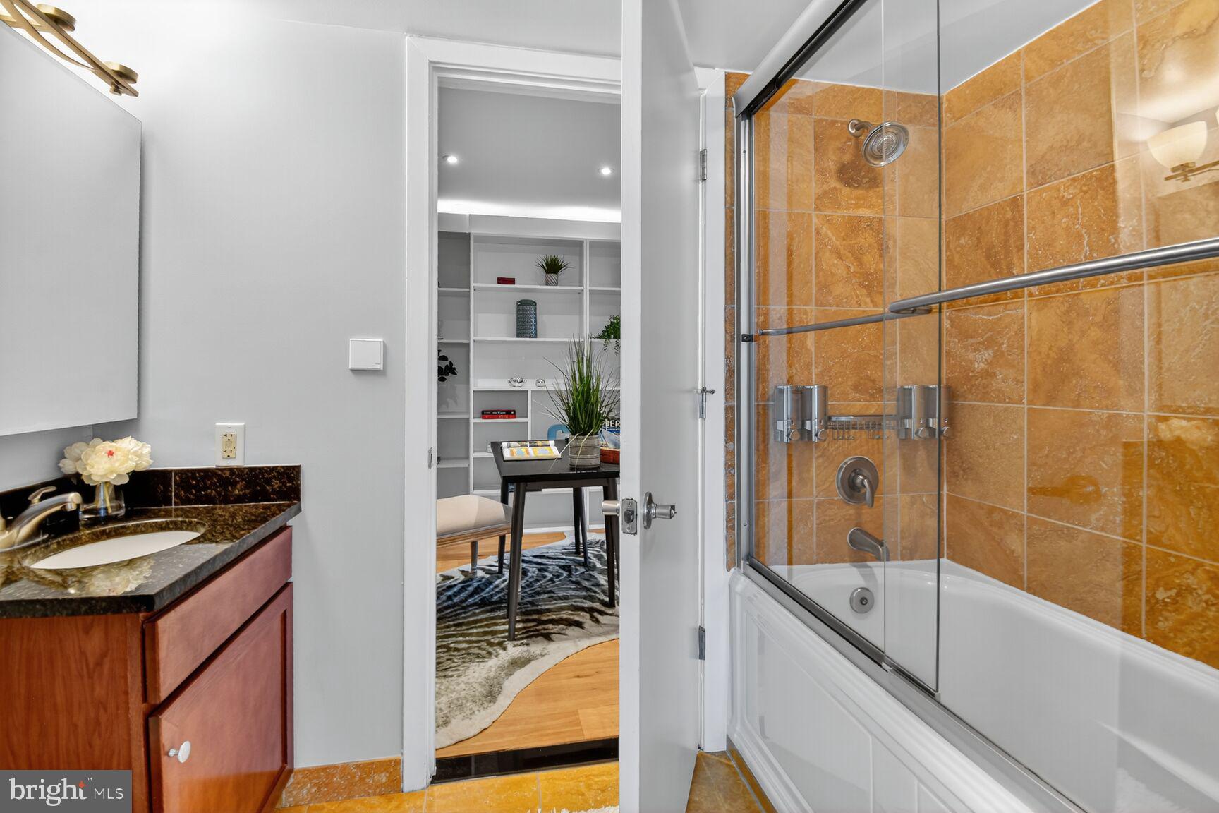 900 Bonifant Street, Unit D Silver Spring, MD 20910 - Photo 27 of 54 a bathroom with a bathtub and a sink